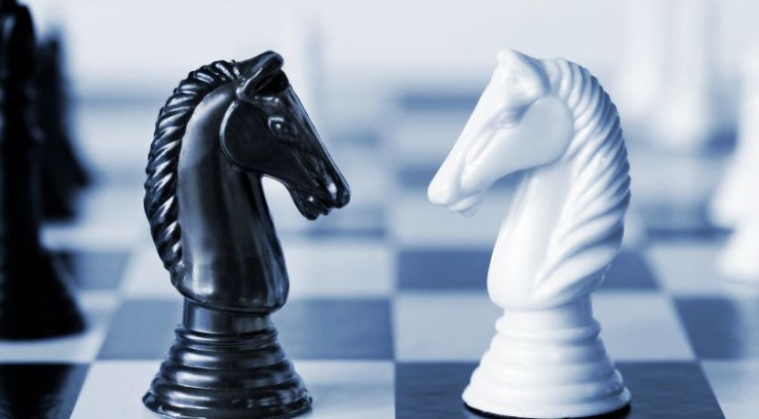Chess pieces; God vs. Satan.