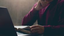 Photo of a person reading a Bible to illustrate the article 