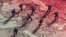 Image of toy soldiers on a map of the Middle East, to illustrate the article Middle East Justice?