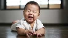 Photo of a baby laughing to illustrate the article Purity in the Bible.