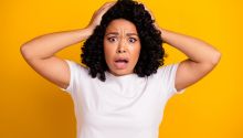 Photo of a girl with her hands on her head looking shocked to illustrate the article Shocking Statements in the Bible: How Can We Understand Them?