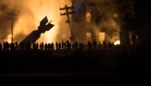 Dark photo of bombs and destruction to illustrate the article 