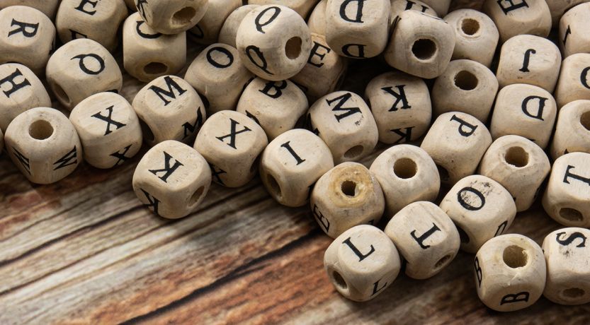 Photo of a jumble of letter cubes to illustrate the article 